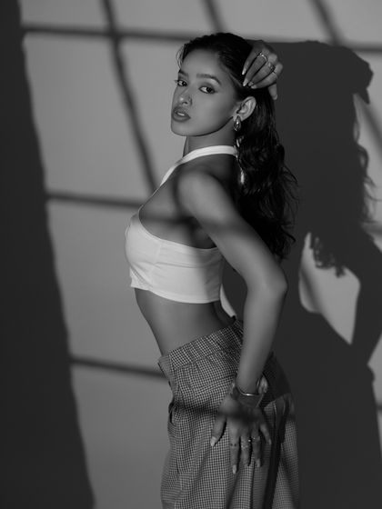 A strong and confident pose in black and white. This profile shot captures a sense of focus and determination.