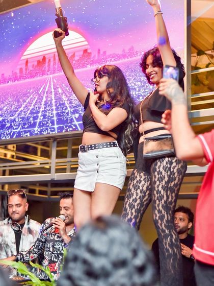 Onstage with some enthusiastic partygoers and a CO2 gun, taking the energy to the next level.