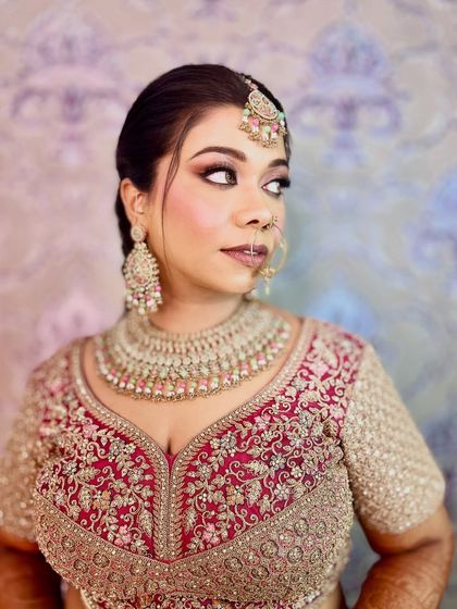 A glance that speaks volumes. For this bride, I designed a dramatic eye makeup look with a sharp wing and full lashes, balanced with a soft pink lip, to match the grandeur of her wedding lehenga.