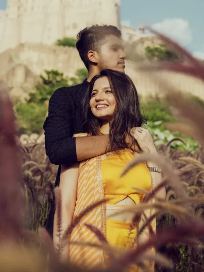 A beautiful shot of the couple surrounded by nature. Her sun-kissed, glowy glam looks effortless and perfect for this romantic, outdoor pre-wedding shoot.