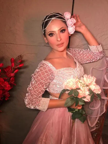 Another angle of the "Rose" look, showing how the floral hairpiece and soft makeup come together for a dreamy, ethereal vibe.
