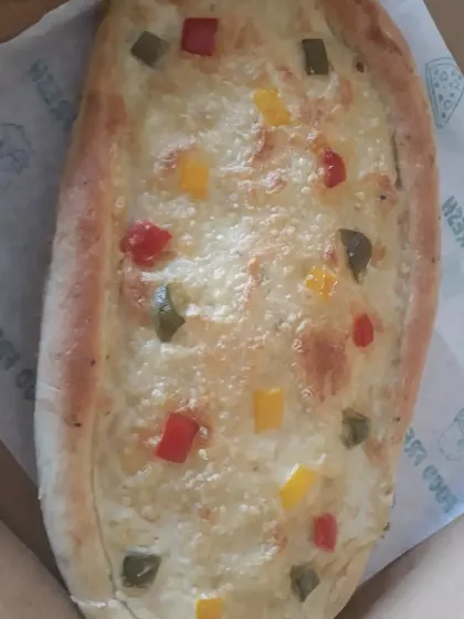 Fresh out of the oven, this vegan Khachapuri is golden brown and bubbling. It’s a wonderful example of how international comfort foods can be recreated with plant-based ingredients.