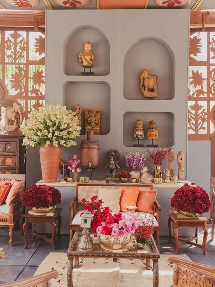 A close-up of the decor, showing how we layer vintage figurines, florals, and textiles to create a rich, story-filled environment.