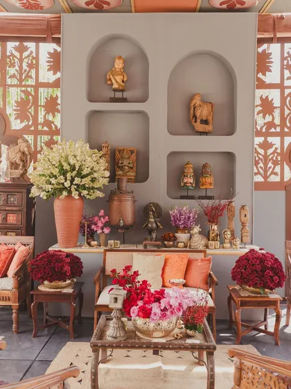 A close-up of the decor, showing how we layer vintage figurines, florals, and textiles to create a rich, story-filled environment.
