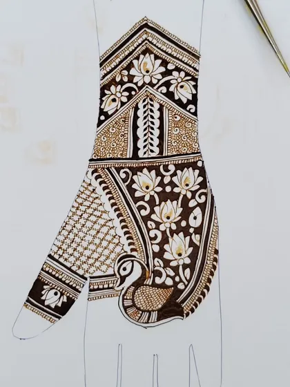 Practice is everything in mehndi. This intricate peacock and lotus design is an example of the advanced patterns we work on to master fine lines and shading techniques.