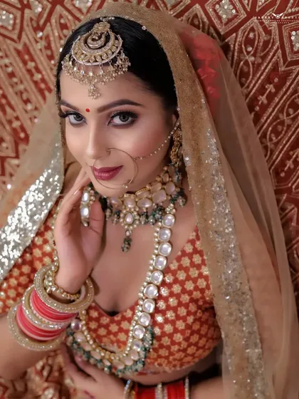 A classic close-up portrait, capturing the bride's direct gaze and beautiful smile.