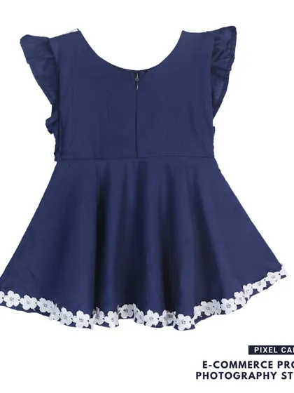 The back view of a navy blue baby frock, showing the zipper and fit.