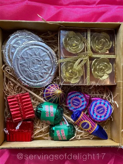 An example of a custom Diwali hamper, featuring my edible rassi bomb and chakra chocolates, along with other beautiful, themed treats.