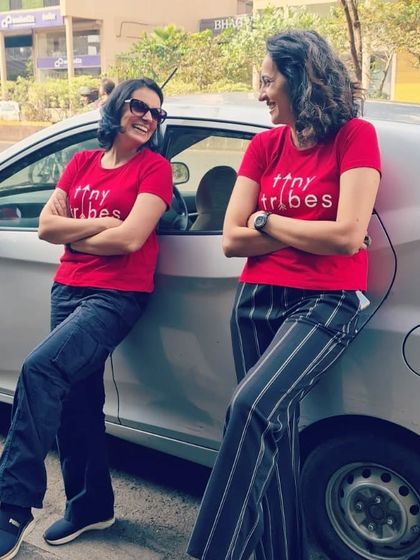 A candid moment of laughter between us. This photo captures the friendship and shared passion that is the foundation of Tiny Tribes. We truly love what we do, and we love doing it together.