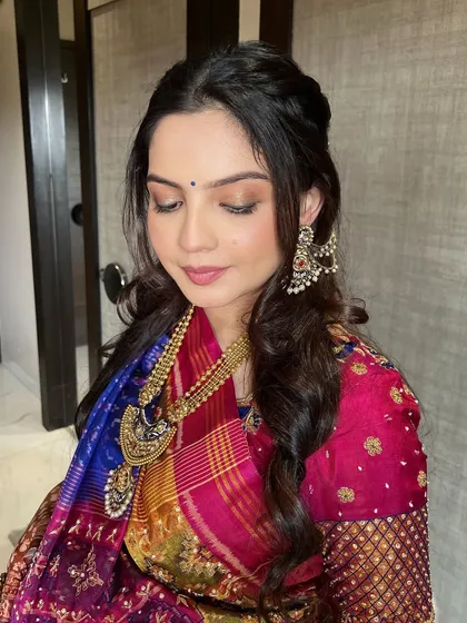 The final look for the Godh Bharai ceremony. The golden glow and minimal base make the mommy-to-be look absolutely radiant and beautiful.
