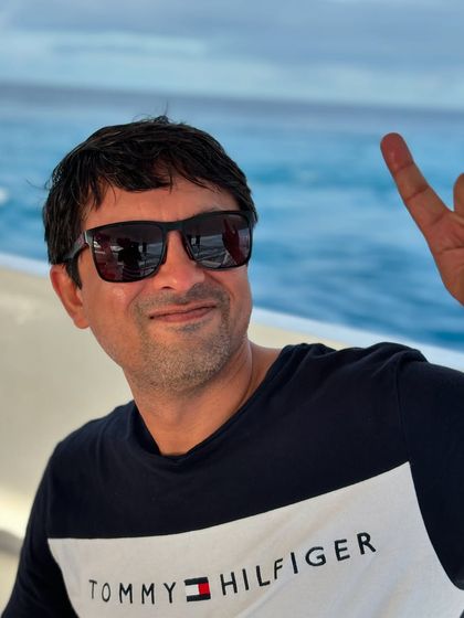 A guest enjoying the boat ride in the Maldives. The journey between dive sites is an adventure in itself.