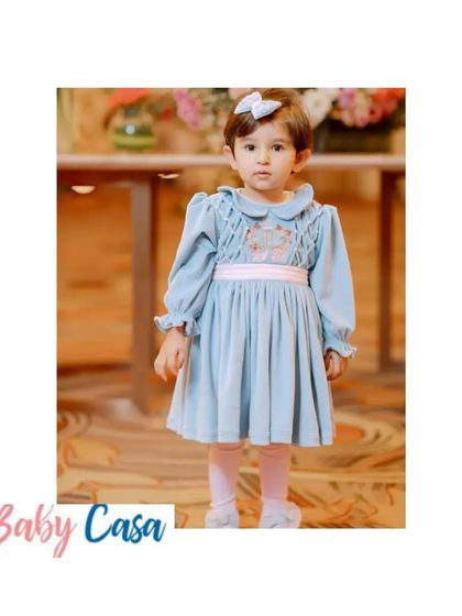 This little girl looks effortlessly chic in our blue velvet winter dress. Our winter collection is crafted to keep your little ones warm without compromising on style.