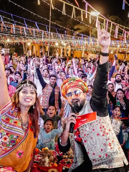 This is the view from my console. A sea of happy faces, hands in the air, completely lost in the music at a massive Raas Garba event in Ahmednagar. My goal is simple: to get every single person on their feet and create a shared moment of pure joy.
