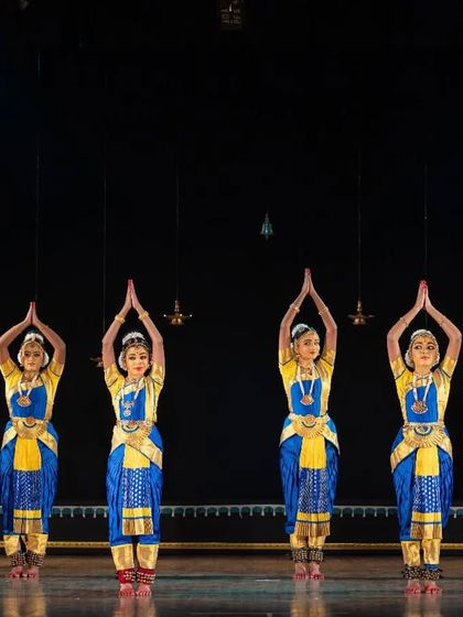 A group of our dancers performing the traditional Allaripu at Nrithya Milanam 2022. This piece is fundamental to Bharatanatyam training, and our students perform it with grace.