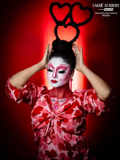 A creative Valentine's look with a heart-shaped hairstyle. Our courses cover both makeup and hairstyling, allowing for complete thematic creations.