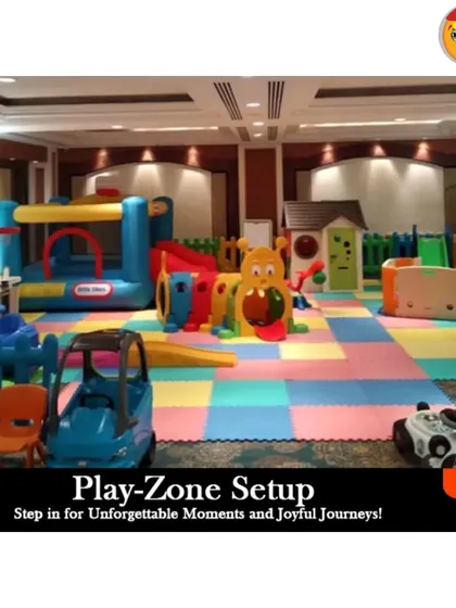 Even a large banquet hall can become a cozy and exciting play area. This indoor playzone setup shows how I use interlocking foam mats and sturdy equipment like a Little Tikes bouncy castle and a caterpillar climber to create a dedicated, fun-filled corner for kids at any event.