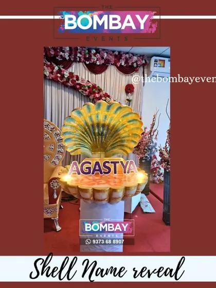 A close-up of our stunning shell name reveal prop, showcasing the name 'Agastya'. This is a unique centerpiece for any Naamkaran Sohala.
