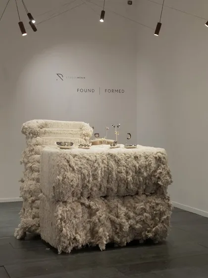 The exhibition display we designed and produced for 'FOUND | FORMED'. The raw, textured cotton provides a soft, organic counterpoint to the precisely crafted jewelry on display.