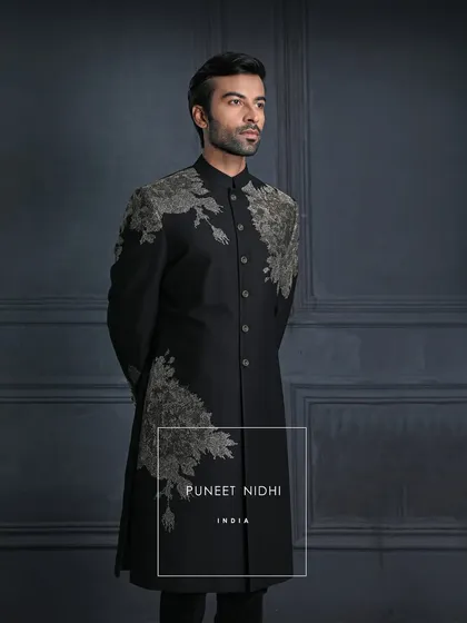 Regal yet understated, bold yet graceful. This black achkan with asymmetric floral embroidery celebrates the harmony of heritage and refinement.