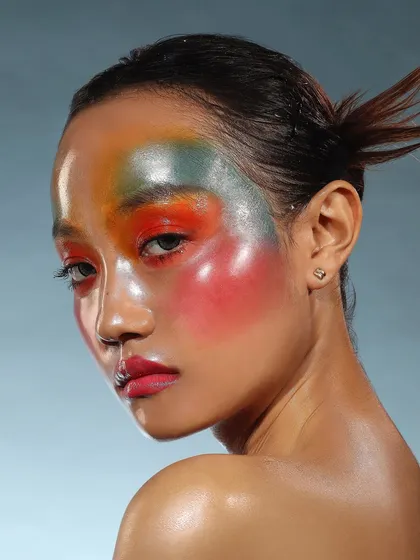 Another variation from the glass skin concept shoot, this time with a watercolor blend of colors across the face for an artistic, ethereal effect.