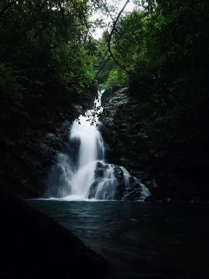 A hidden waterfall in the Sagar region, with its dark pool inviting a cool dip. We love taking you to these offbeat spots.