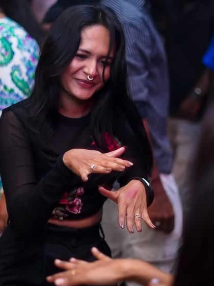 A candid moment of a guest dancing at Lux.