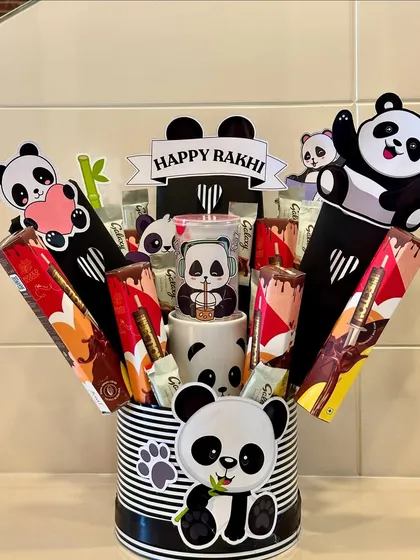 An adorable panda-themed hamper for your little panda lover. This black and white hamper comes with a cute panda mug and is filled with delicious chocolates.