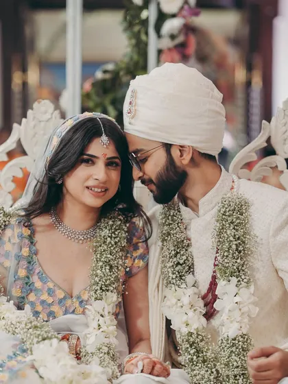 A classic couple portrait. The bride's soft makeup complements the groom's simple and elegant attire.
