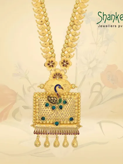 A piece of the past, crafted in gold. This long necklace features a rectangular pendant with a peacock motif, showcasing our skill in creating unique, heritage-inspired designs.