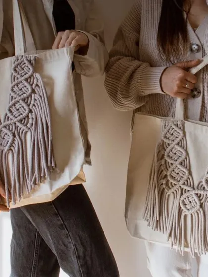 My eco-friendly tote bags are perfect for when you need a little extra space. I take a simple cotton tote and add my own unique macrame designs, like this "DNA wala" pattern, to make it special.