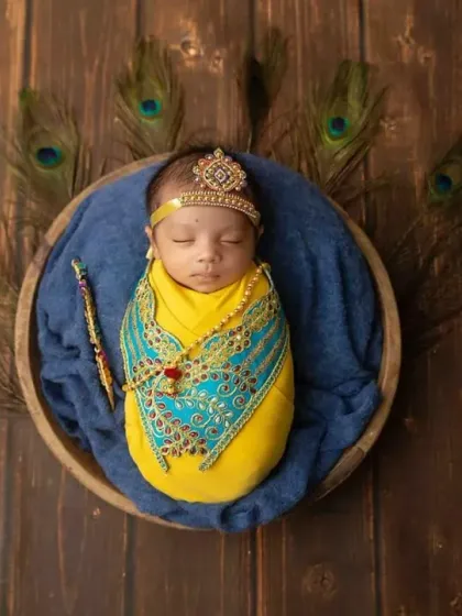 Bringing creative themes to life is my passion. For this newborn session, we transformed the studio to capture this little one as a divine Little Krishna, complete with a tiny crown and peacock feathers. I love crafting unique, memorable portraits like this.