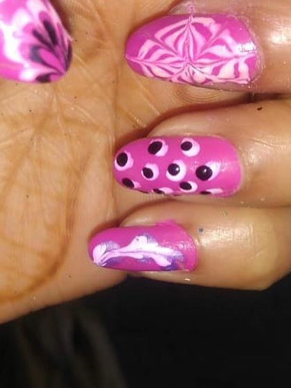 An example of more intricate nail art with different patterns on each nail. This is a great activity for slightly older children.