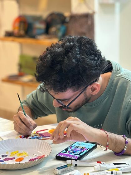 Using a phone for reference to paint a favorite character. In my private workshops, you have the freedom to create whatever you want.