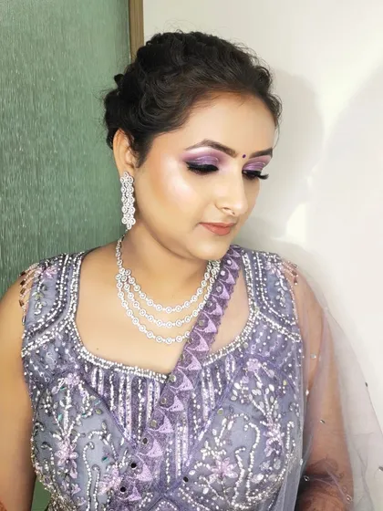 This client wanted a soft and shimmery look for her engagement. I used lilac and silver tones on her eyes to match her beautiful embroidered lehenga.