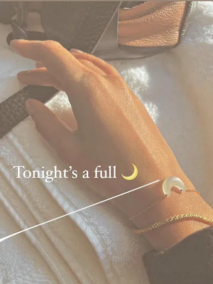 A lifestyle view of the 'ádhvaya' white moonstone Luna bracelet. It's a simple, elegant piece meant to bring calm and attract abundance into your life.
