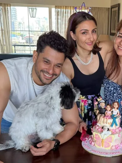 Soha Ali Khan and Kunal Khemu celebrating with their family. I created this cake based on their daughter Inaaya's vision, featuring edible figurines of the whole family, including their dog, Oreo.