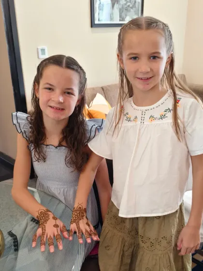 Two happy sisters showing off their matching mehndi designs. We love creating special moments like these.