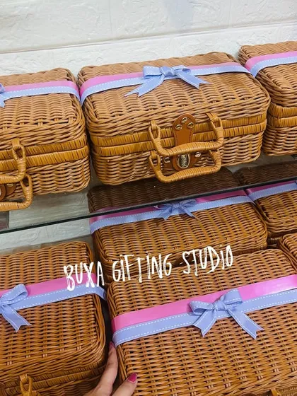 A row of the beautiful bridesmaid trunks, tied with personalized ribbons, waiting to be filled with gifts.