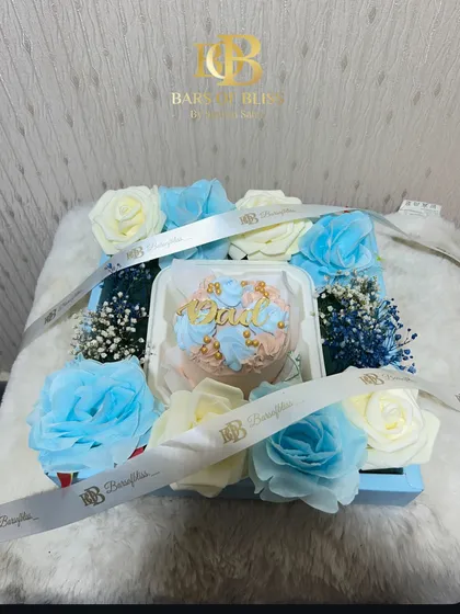 This version of the floral hamper for Dad includes a bento cake nestled among the flowers.