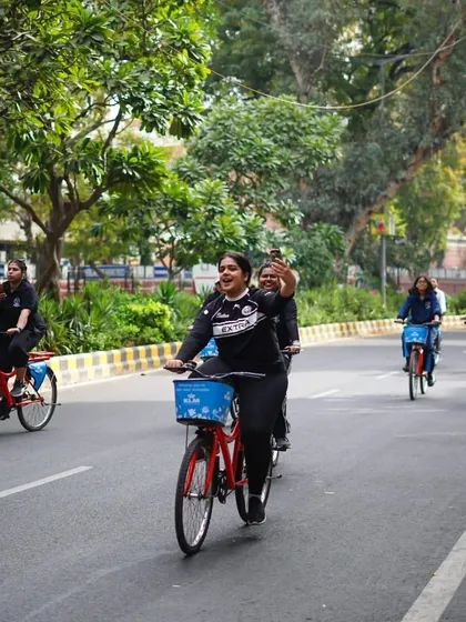 A rider captures a selfie while cycling with the group. We encourage you to capture your favorite moments from the tour.