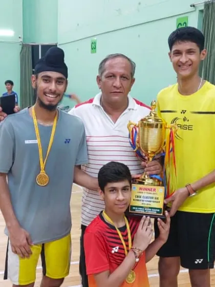 Our CBSE North Cluster champions proudly holding their trophy alongside their coach. This victory is a result of dedicated team effort and rigorous preparation for school-level tournaments.