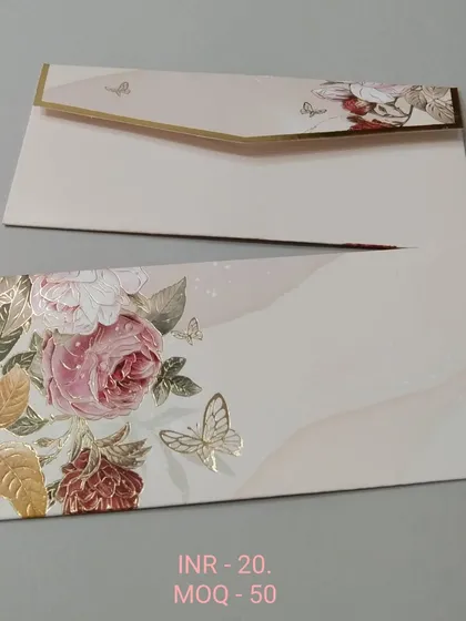For a more modern touch, this envelope features a soft watercolor background with a spray of pink and gold foil flowers and butterflies. It's perfect for engagements, receptions, or festive gifting.