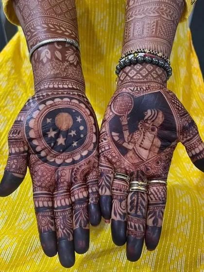 For Karva Chauth, I create designs that tell a story. This one features the classic scene of a wife looking at the moon through a sieve on one palm, and a portrait of her husband on the other, making it deeply personal.