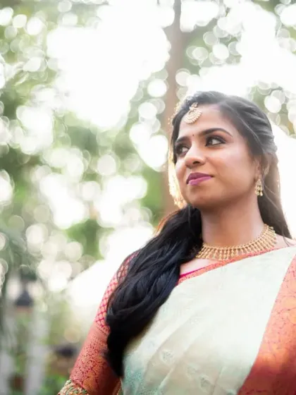 A beautiful outdoor bridal portrait. The soft, natural light and the bokeh background make the bride stand out.