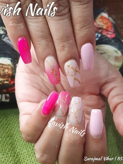 A bright and cheerful set with different shades of pink and a gold marble accent nail.