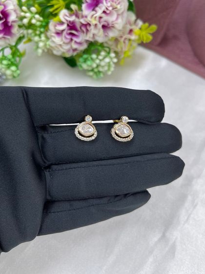 A close-up of the simple yet elegant stud earrings that come with our lightweight necklace sets. These are perfect for daily wear.