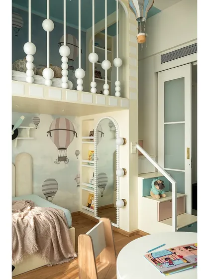 A closer look at the details in the whimsical kids' room, from the small staircase with built-in storage to the soft, pastel color palette. Every nook is crafted to be both beautiful and practical.