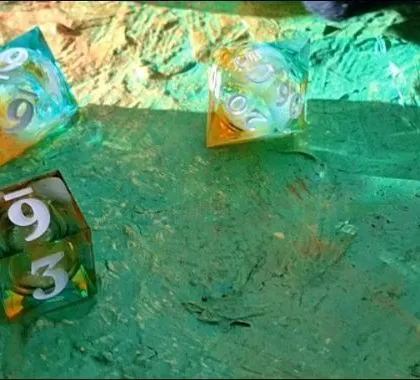 A close-up of the hand-painted, textured board we created for our galaxy-themed dice video.