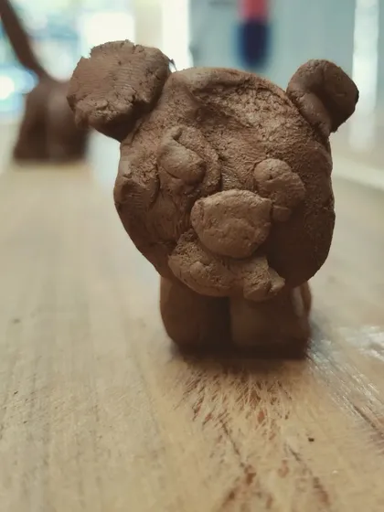 A close up of a sweet little clay bear, created during one of my kids workshops. Small hand built sculptures like this allow children to bring their favorite characters and animals to life.