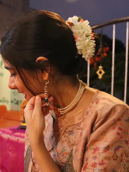 A close-up shot from my devotional music video. The traditional attire and flowers are part of creating an authentic and sacred visual and auditory experience.
